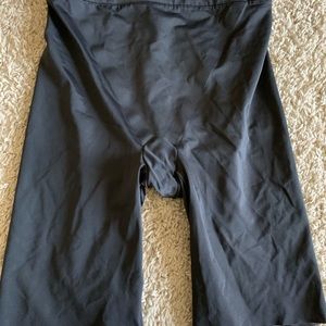 Black, slick material like, biker shorts